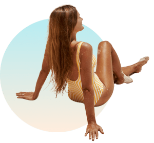 Woman enjoying the sun outdoors on a beach.